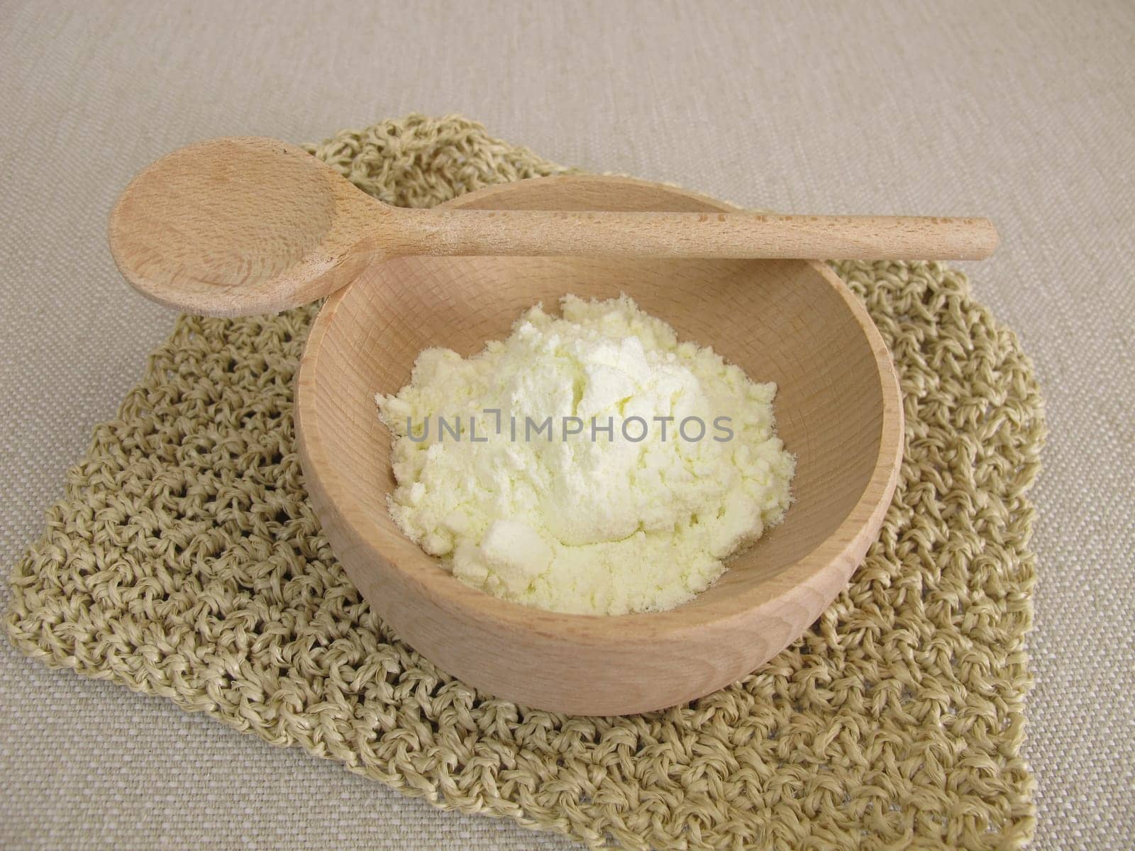 Milk powder in a small wooden bowl