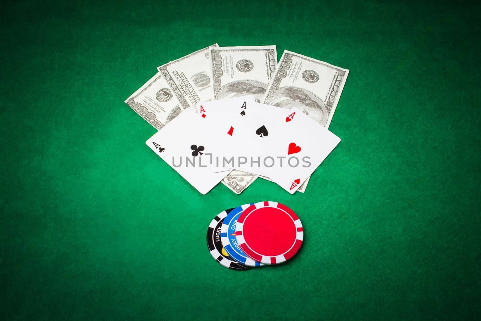 Poker cloth, a deck of cards and chips. Background.