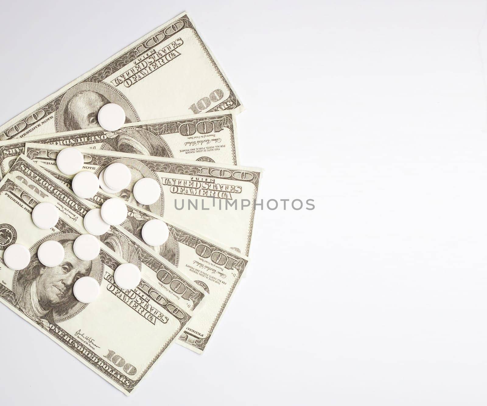 White pills and money, health expense concept, health care cost, medical business