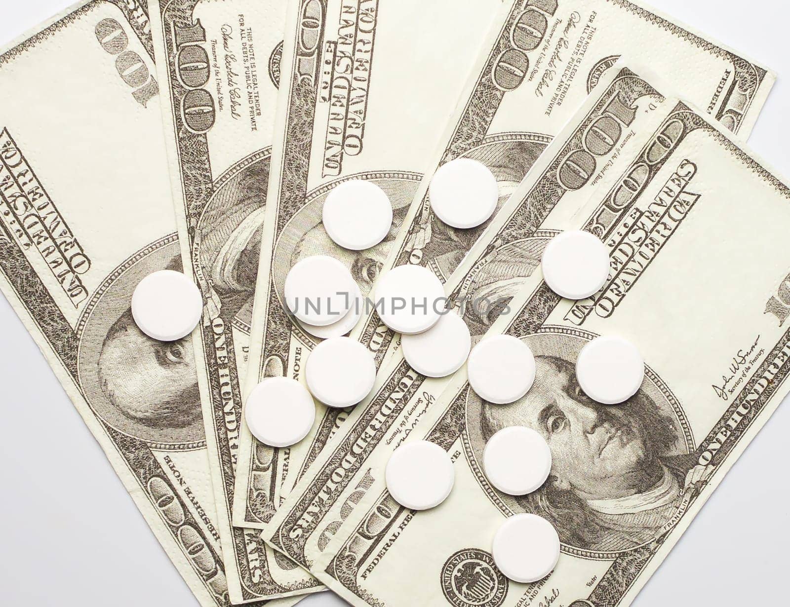 White pills and money, health expense concept, health care cost, medical business