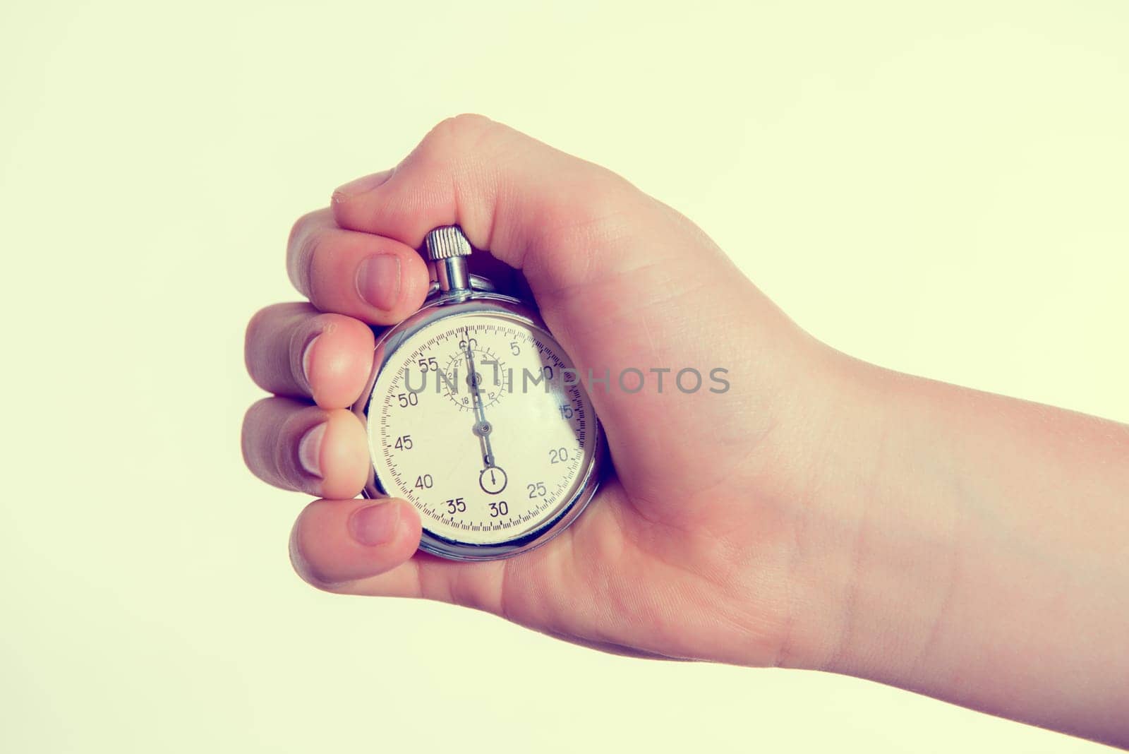 hand with stopp watch in front of white background