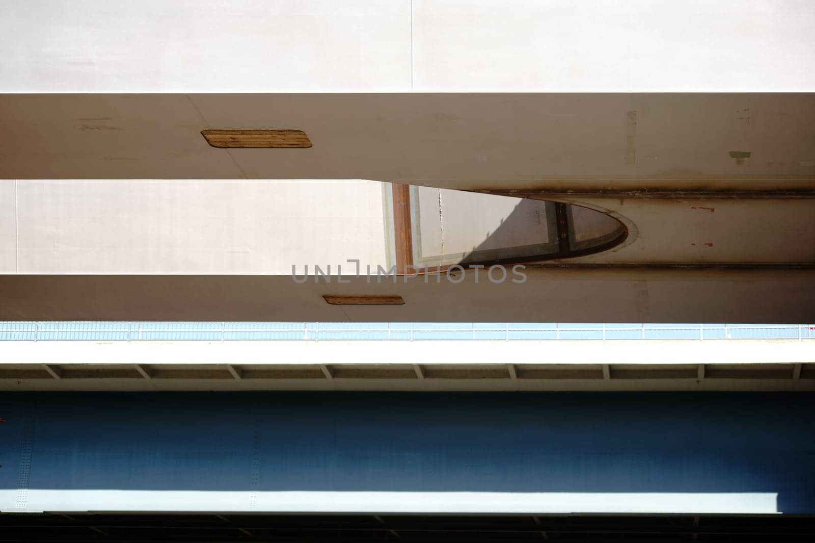 The shelter of the bridge railing and the bridge floor of an expressway.