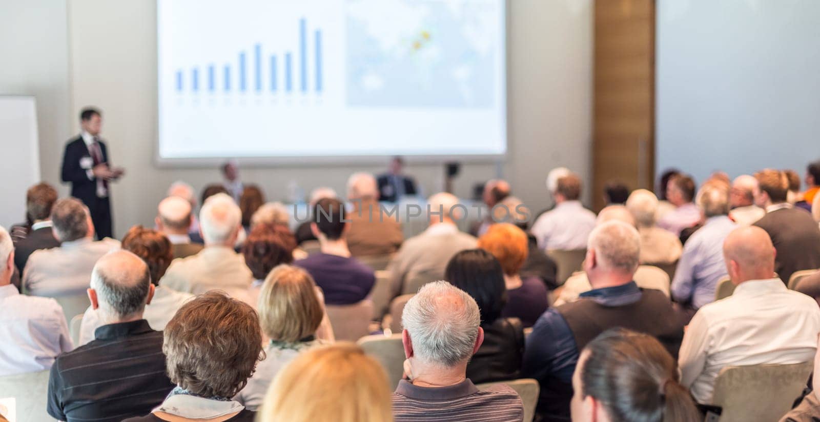 Speaker Giving a Talk at Business Meeting. Audience in the conference hall. Business and Entrepreneurship.