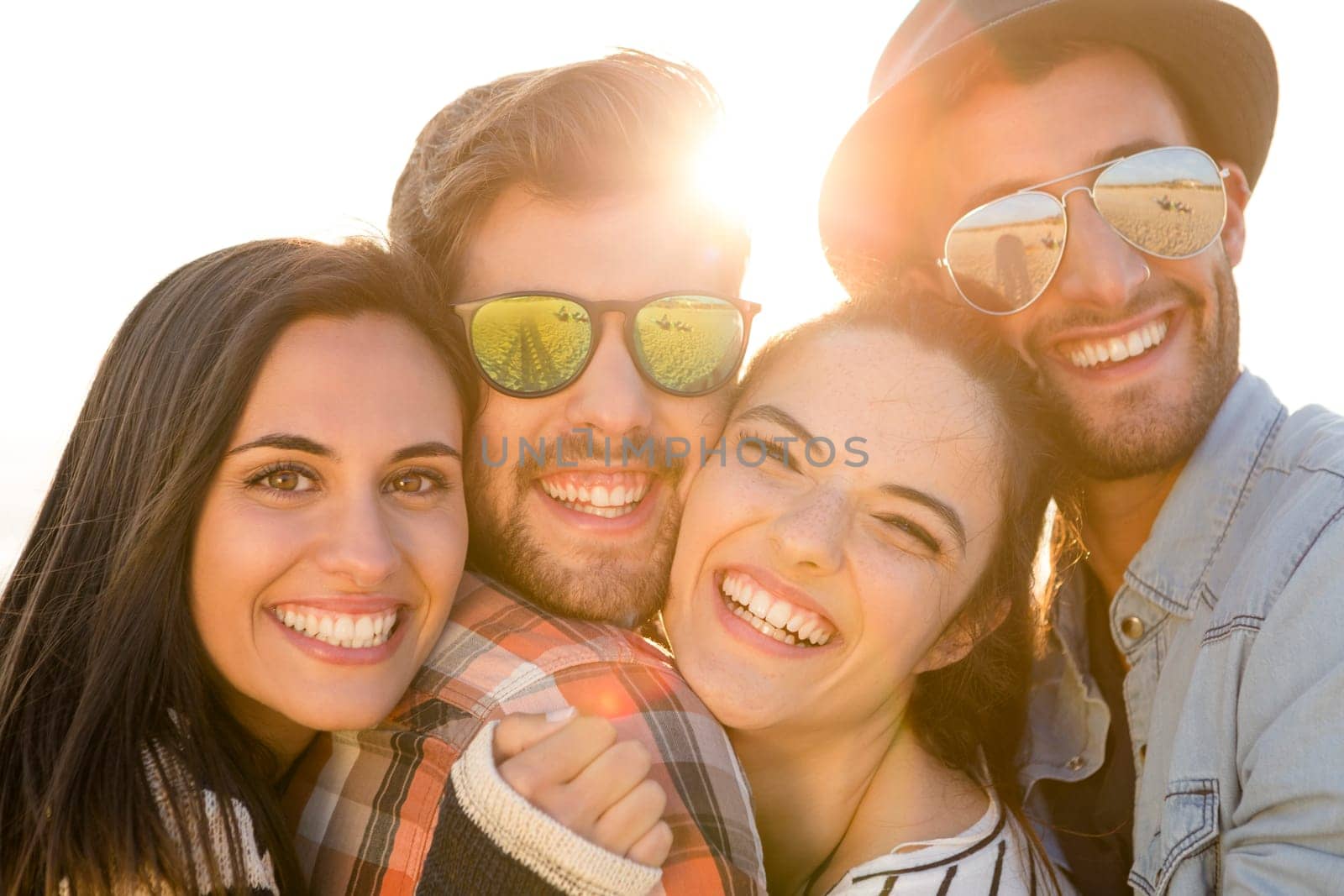 Group of friends having fun at the beach