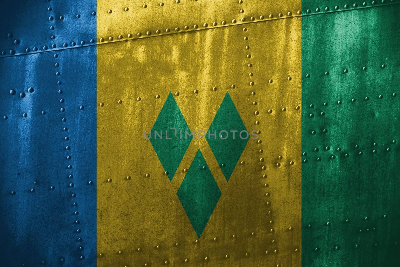 metal texutre or background with st. vinc & grenadines flag