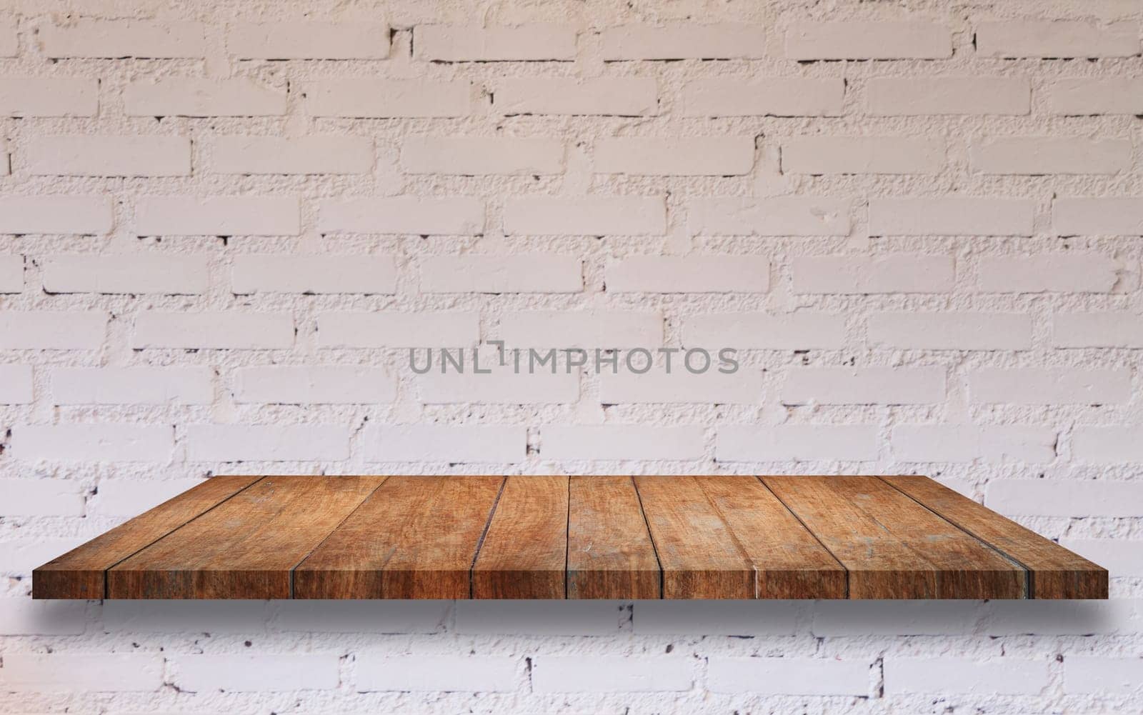 Top of wooden shelf with white brick wall decorated in coffee shop