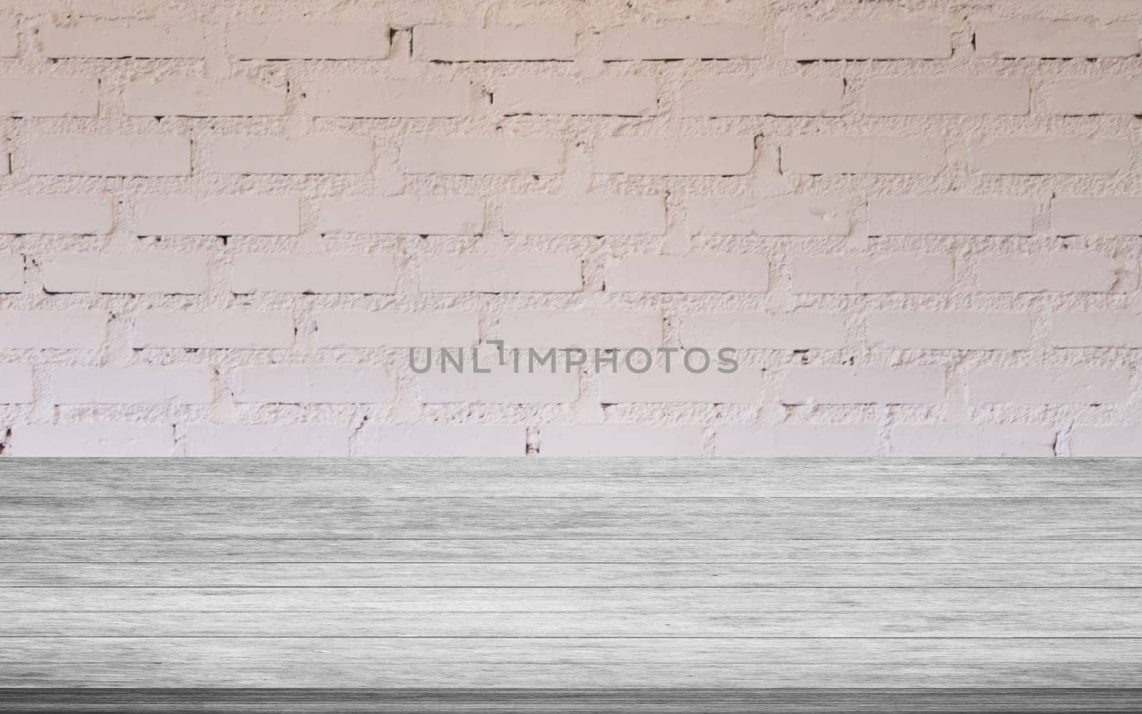Top of black and white wooden table with white brick wall decorated in coffee shop