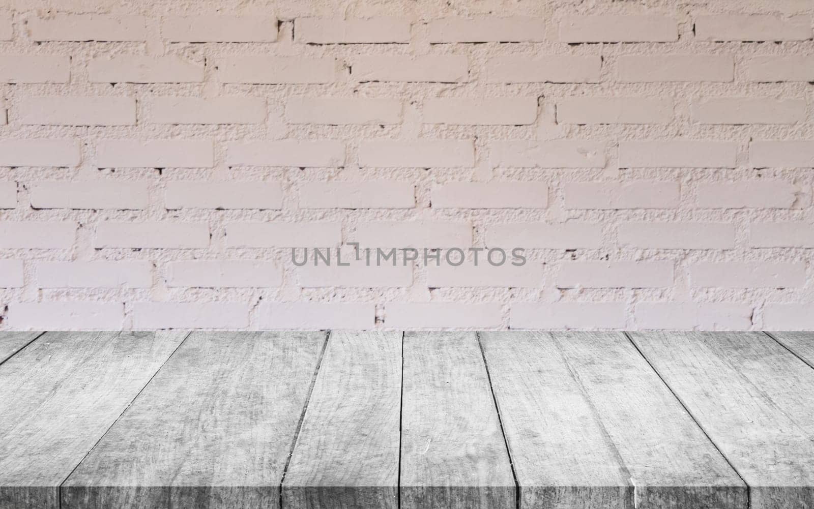 Black and white wooden table top with white brick wall decorated in coffee shop