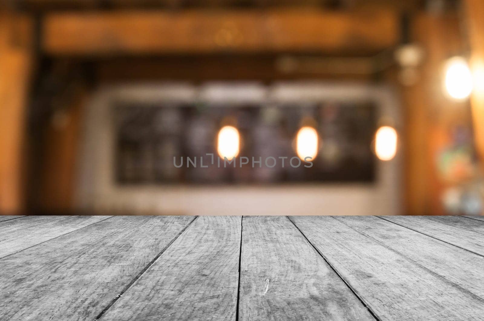 Black and white wooden table top with coffee shop blurred abstract background