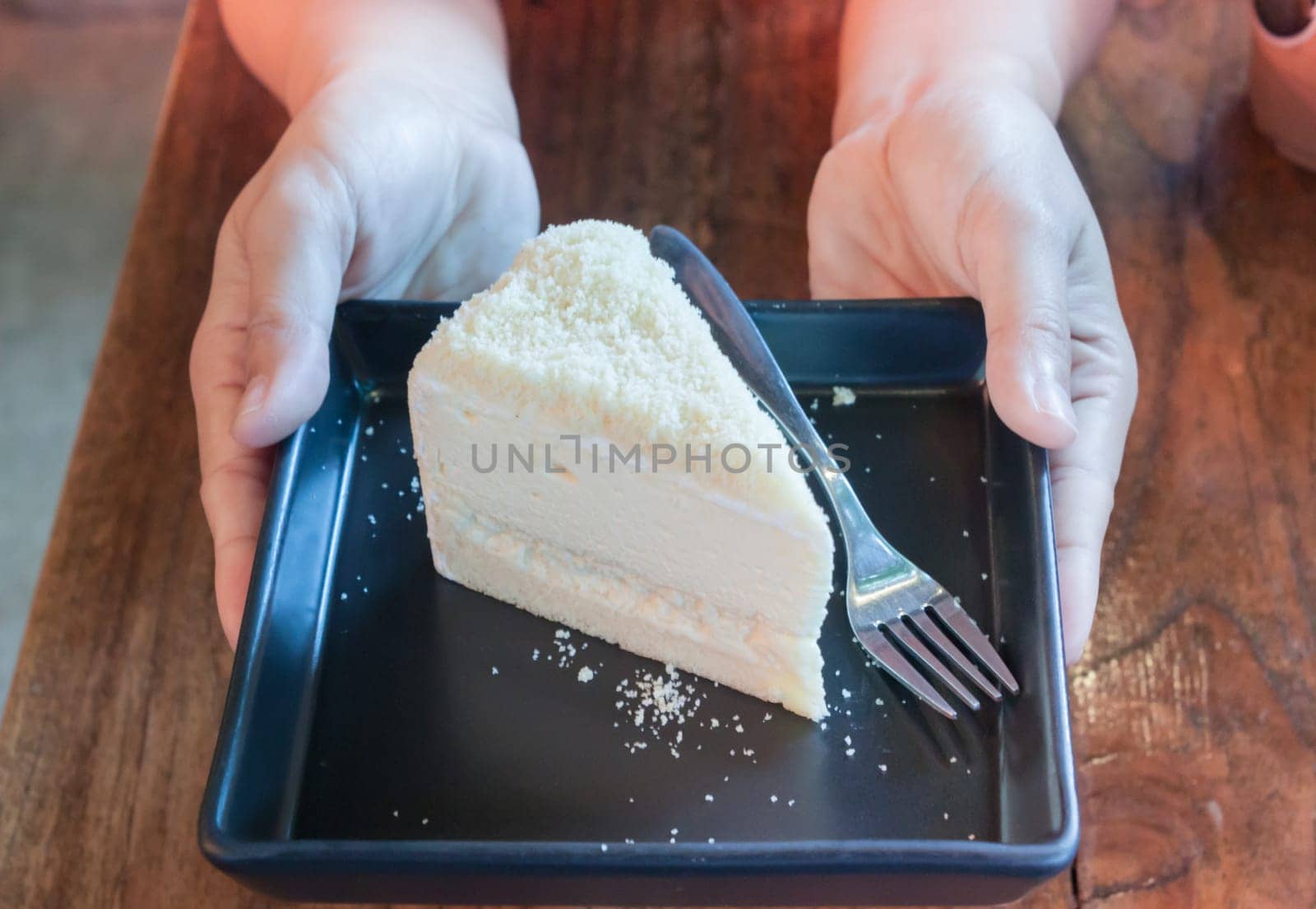 Closeup cheese cake on black plate, stock photo