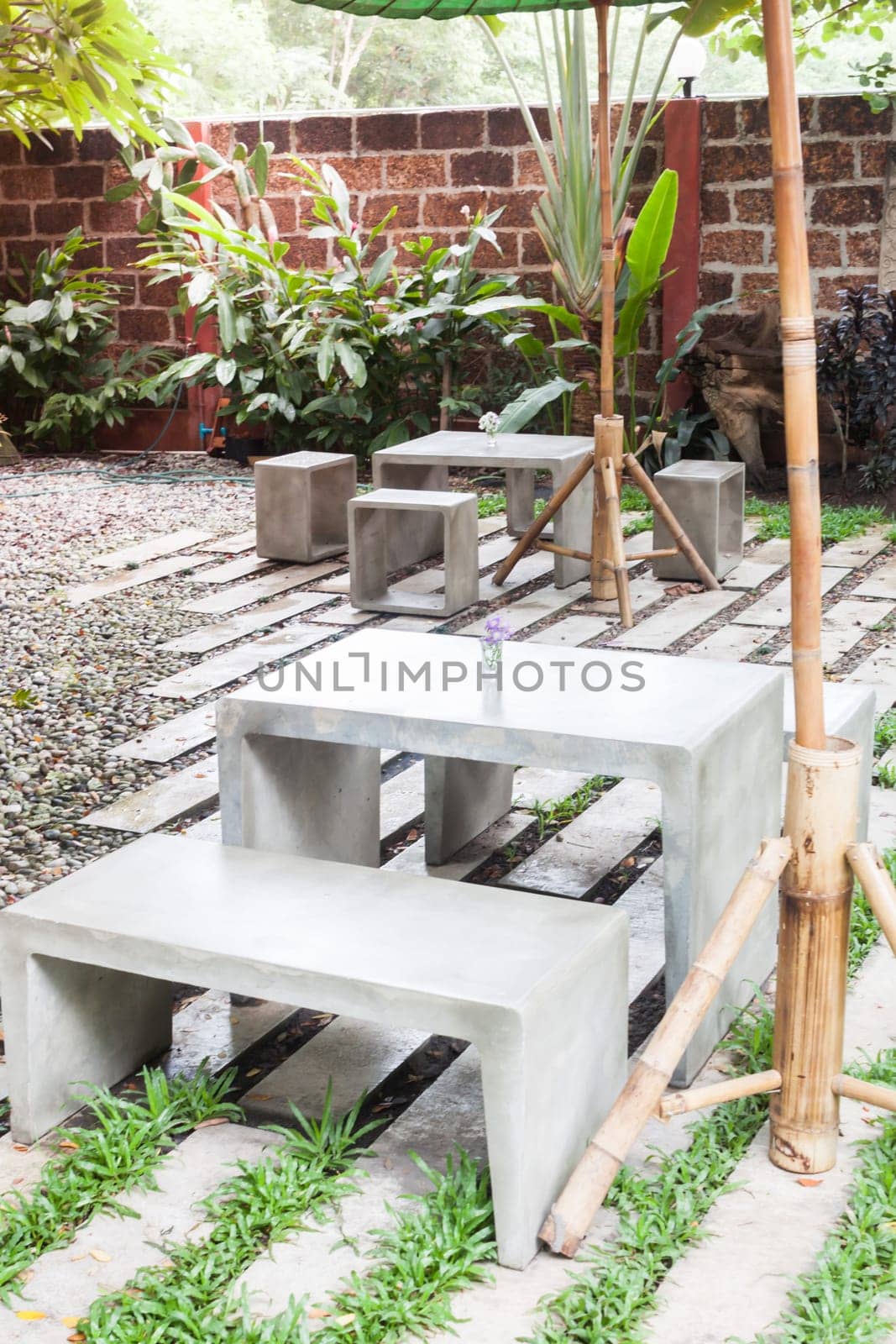 Decorated concrete table and chair in coffee shop, stock photo