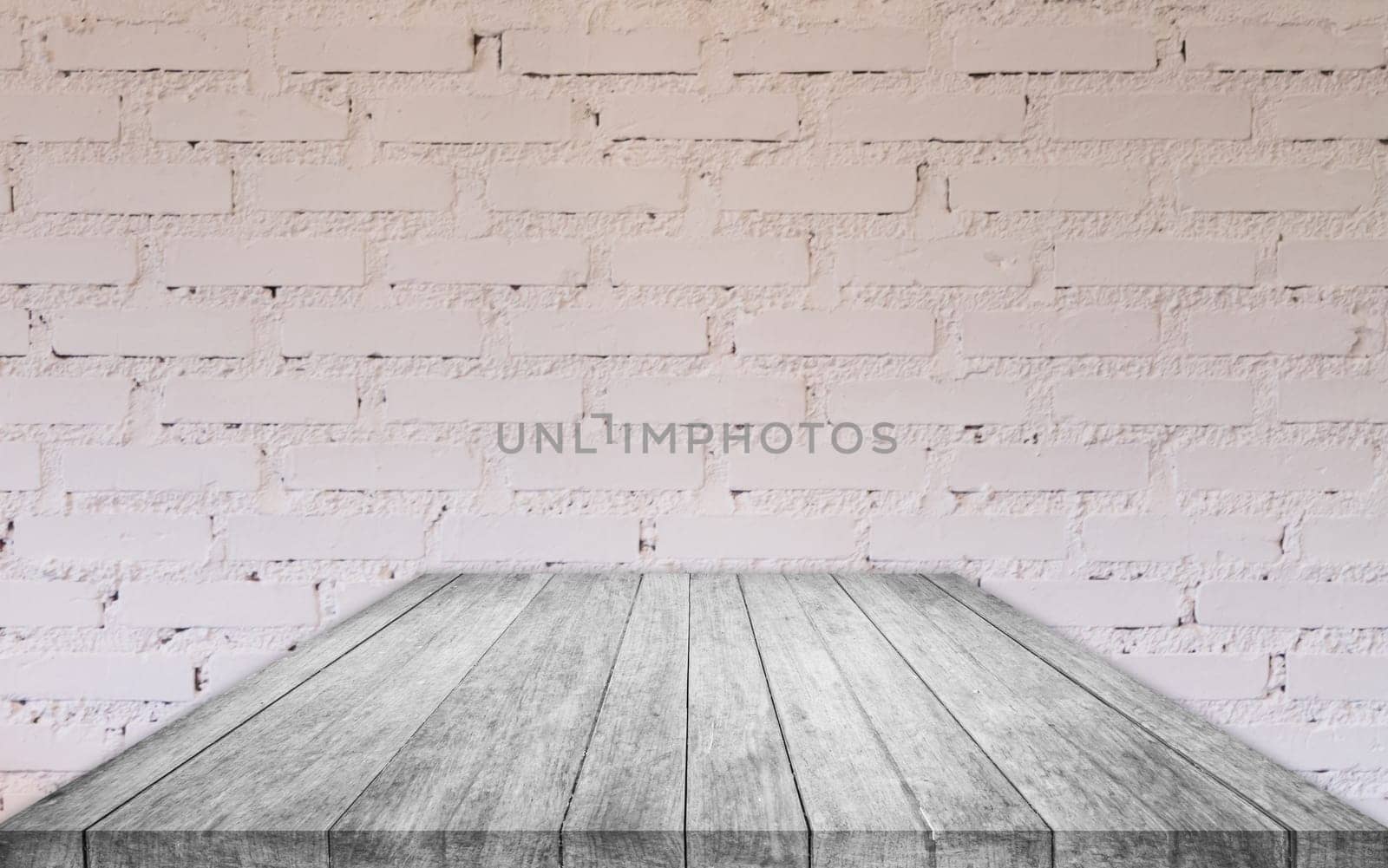 Perspective black and white wooden table top with brick wall decorated in coffee shop
