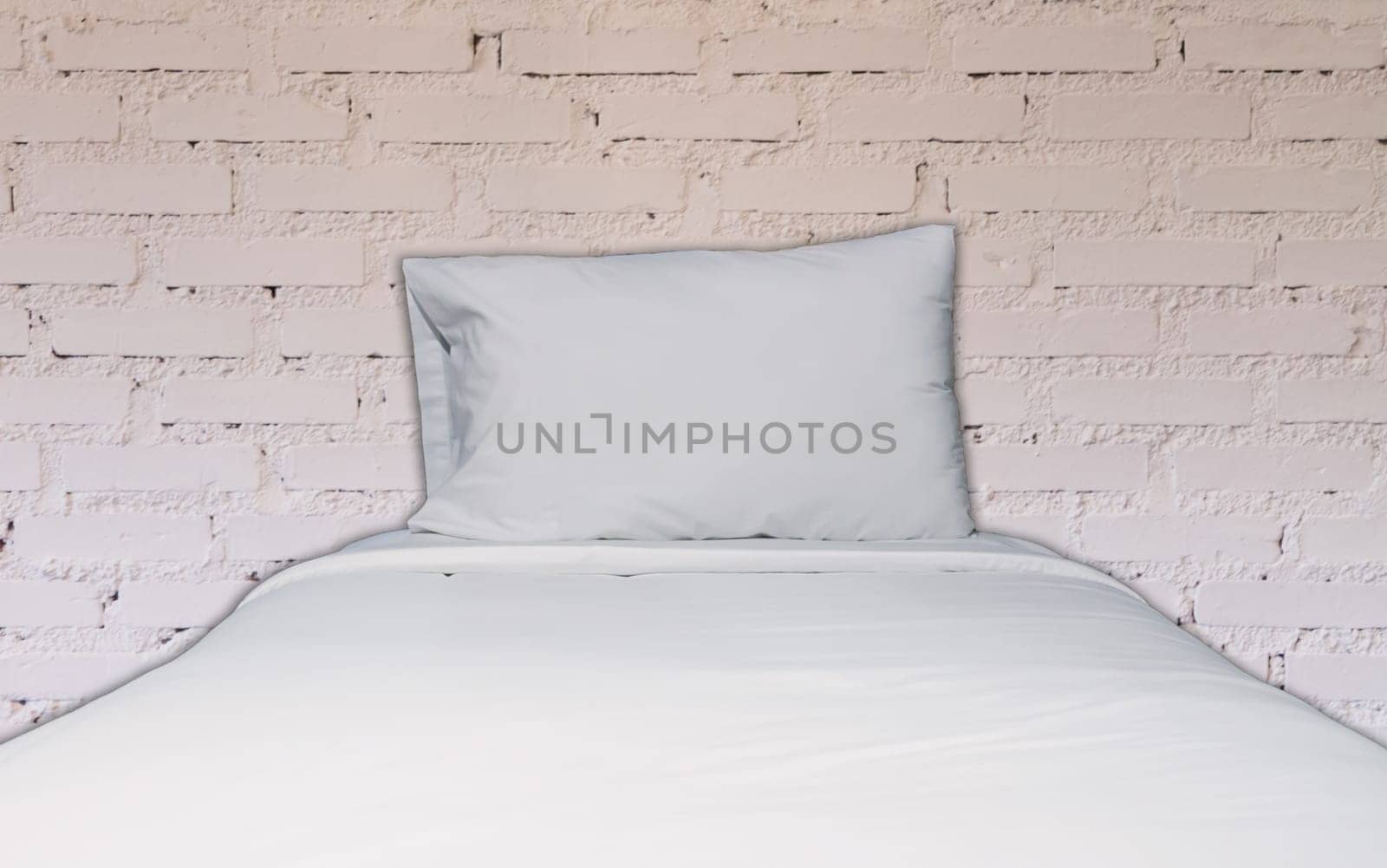 Single bed with white brick wall decorated in coffee shop