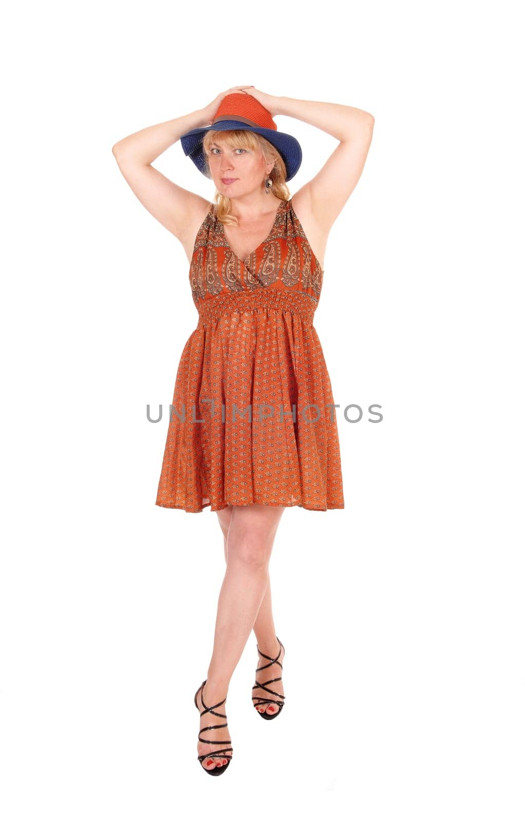 A portrait image of a pretty blond woman in a dress wearing a summer.hat, isolated for white background..