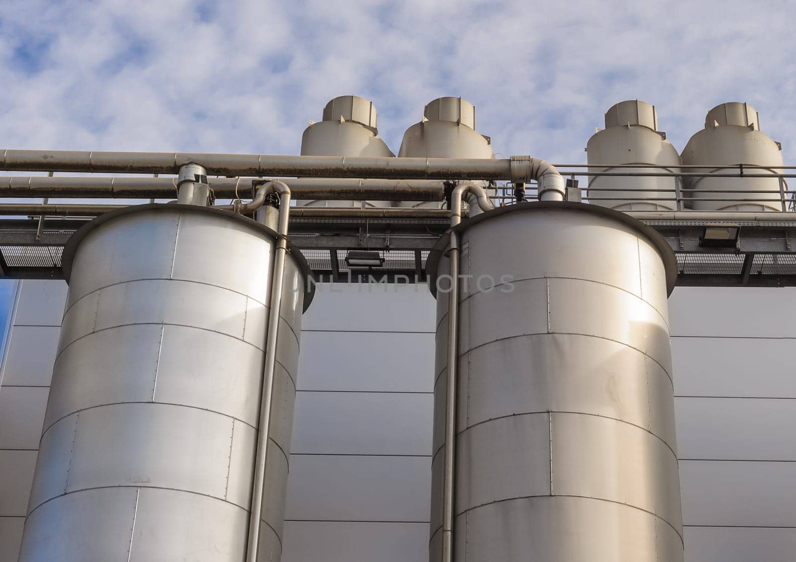 Detail of chemical plant, silos and pipes