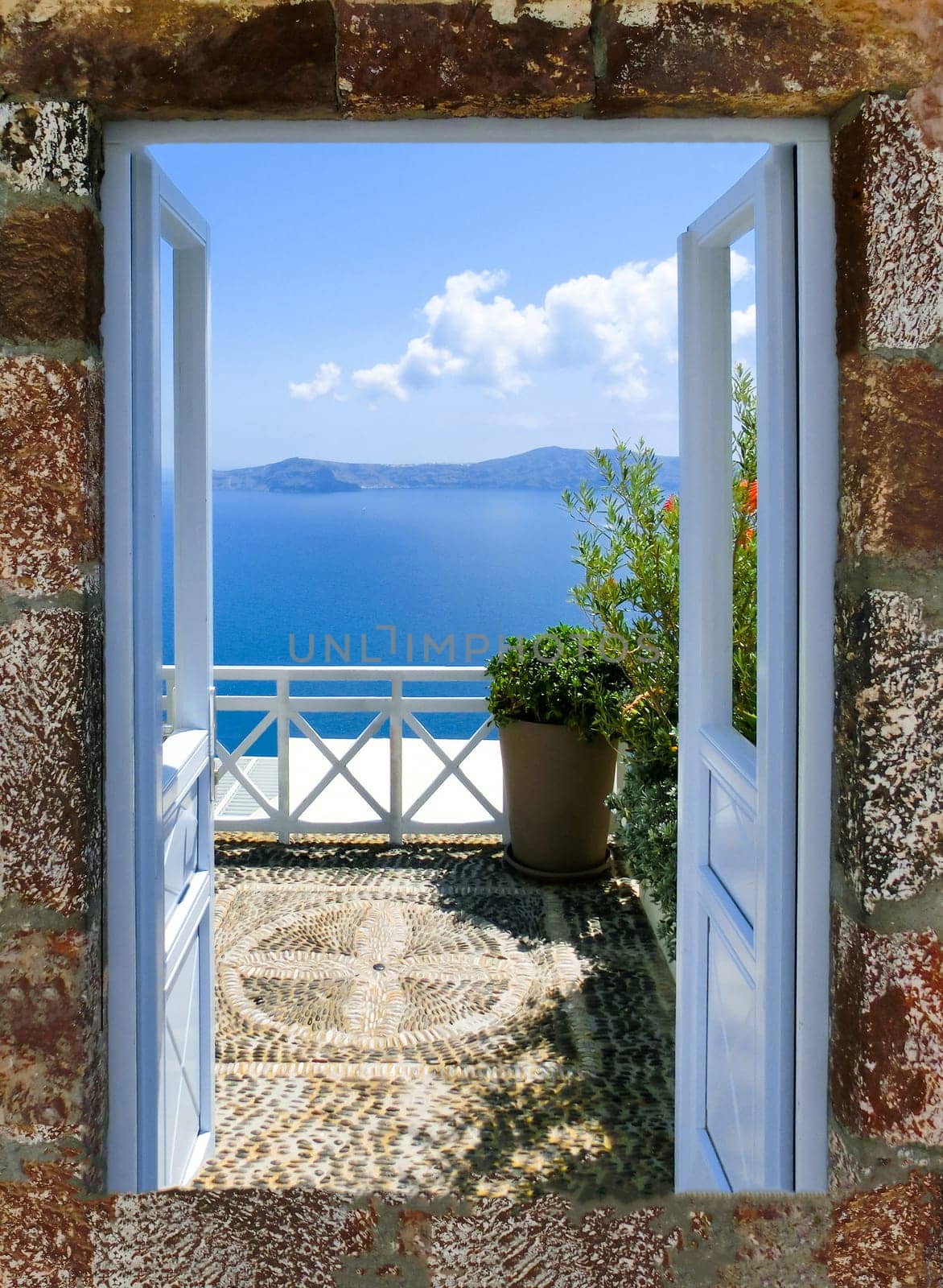 Beautiful sea view from the balcony. Oia town, Santorini island, Greece.