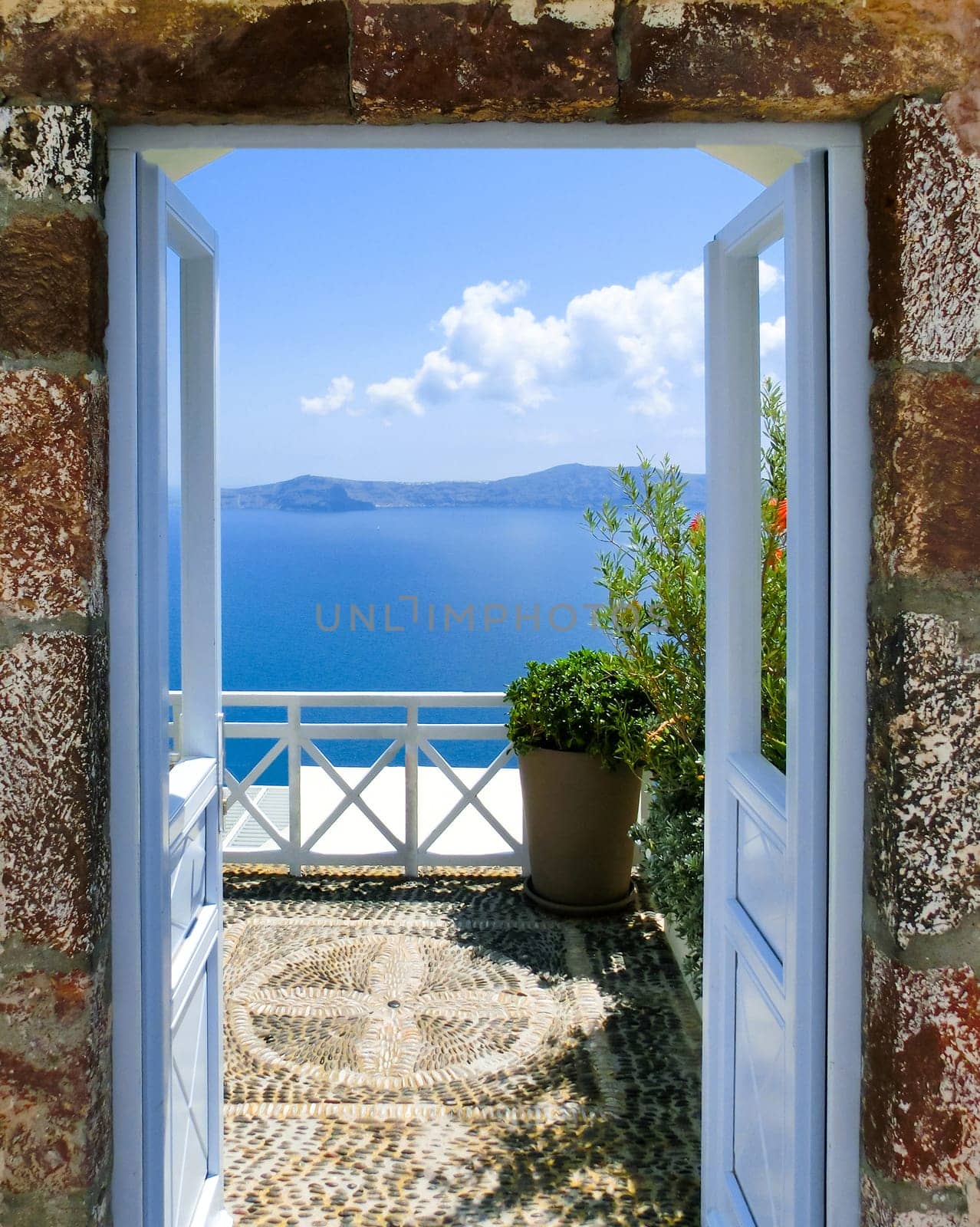 Beautiful sea view from the balcony. Oia town, Santorini island, Greece.