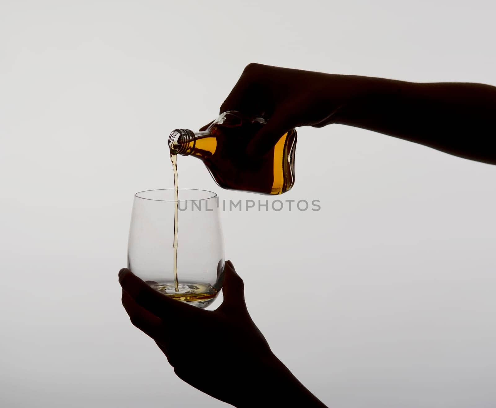 Woman pours liquor