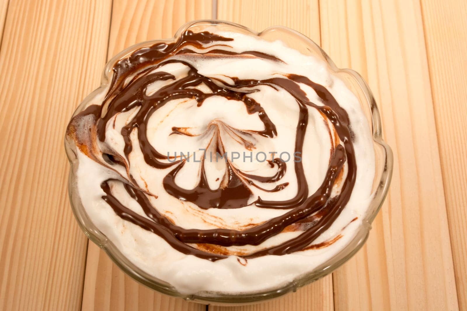 Vanila and chocolate desert in glass pot