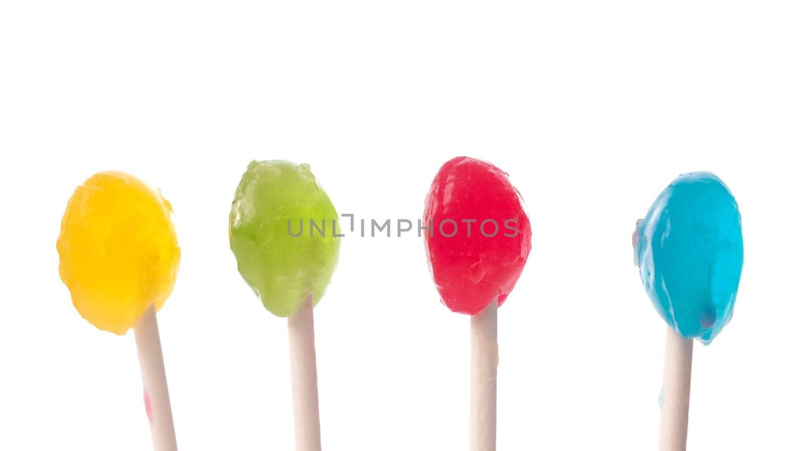 Colorful lollypop in a row on a white background