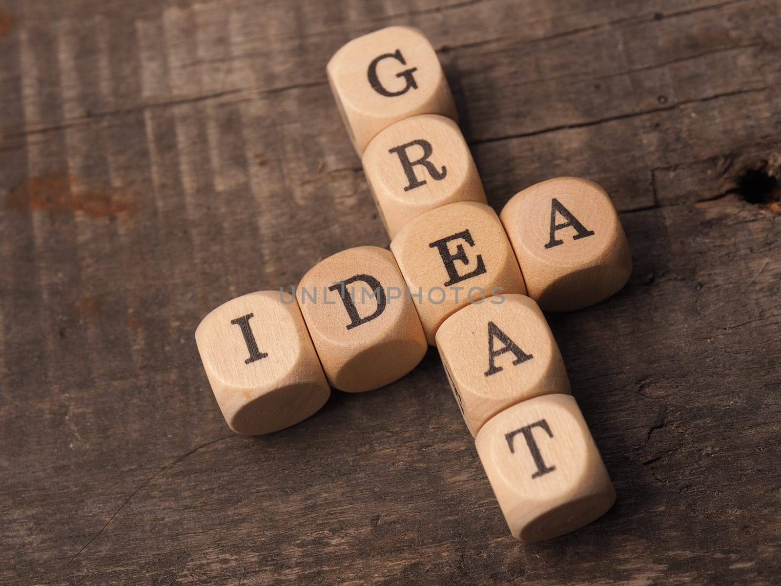 Wooden dices with the crosswords Great idea on a rustic table