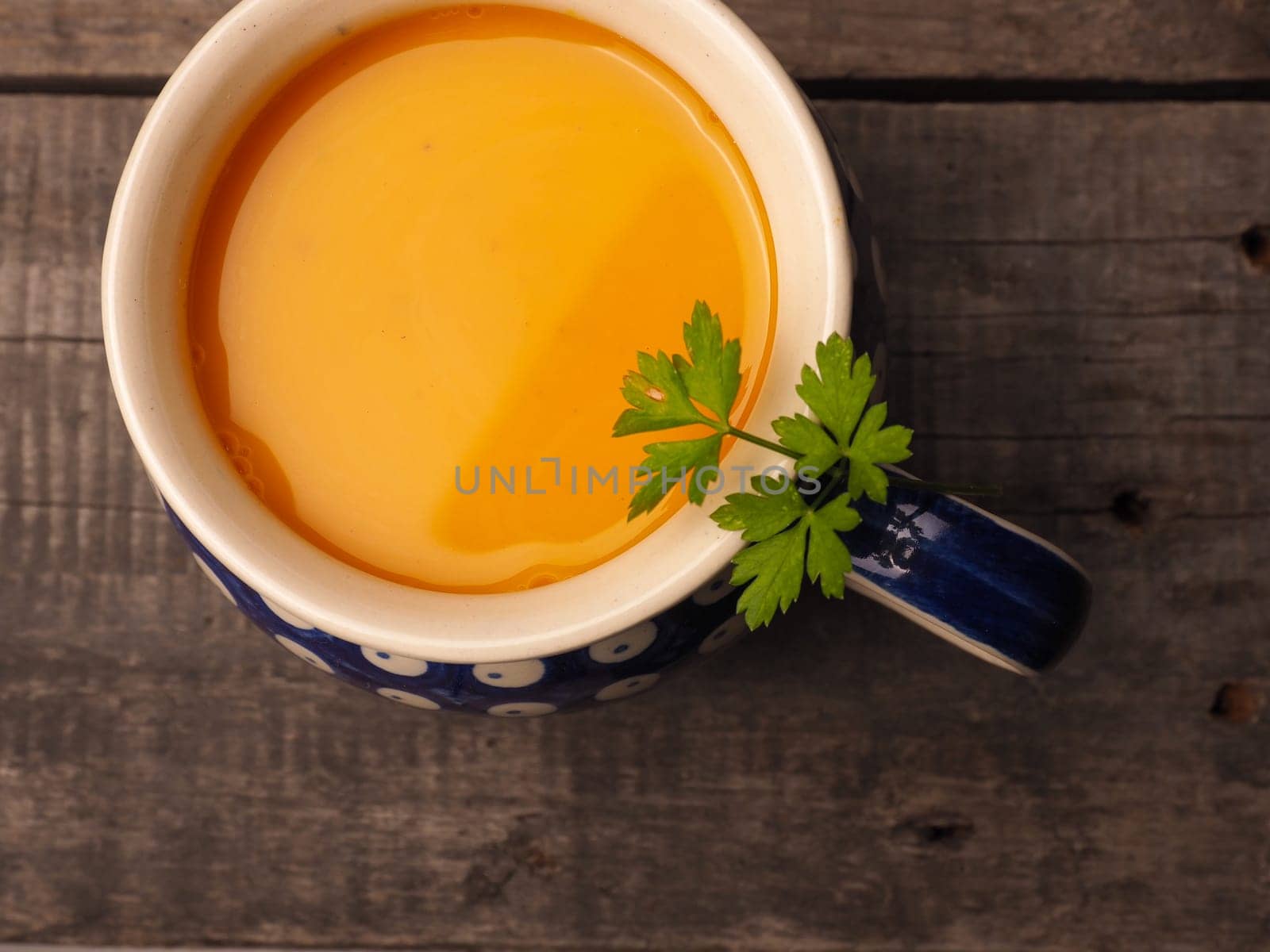 Hokkaido cream soup in a rustic bowl on a wooden kitchen table