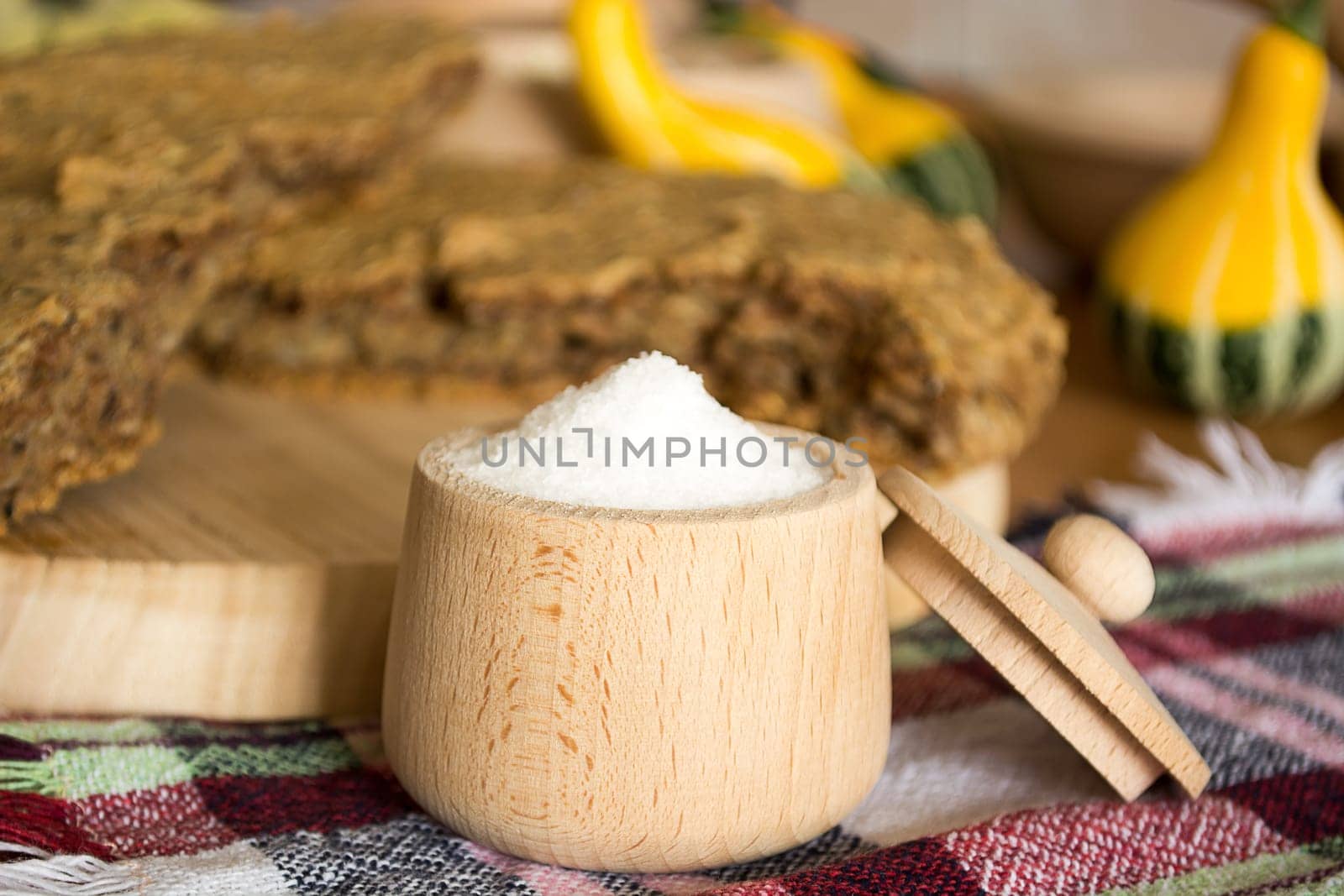 Just baked, fresh, domestic unleavened barley bread on the wooden plate, cutted in half