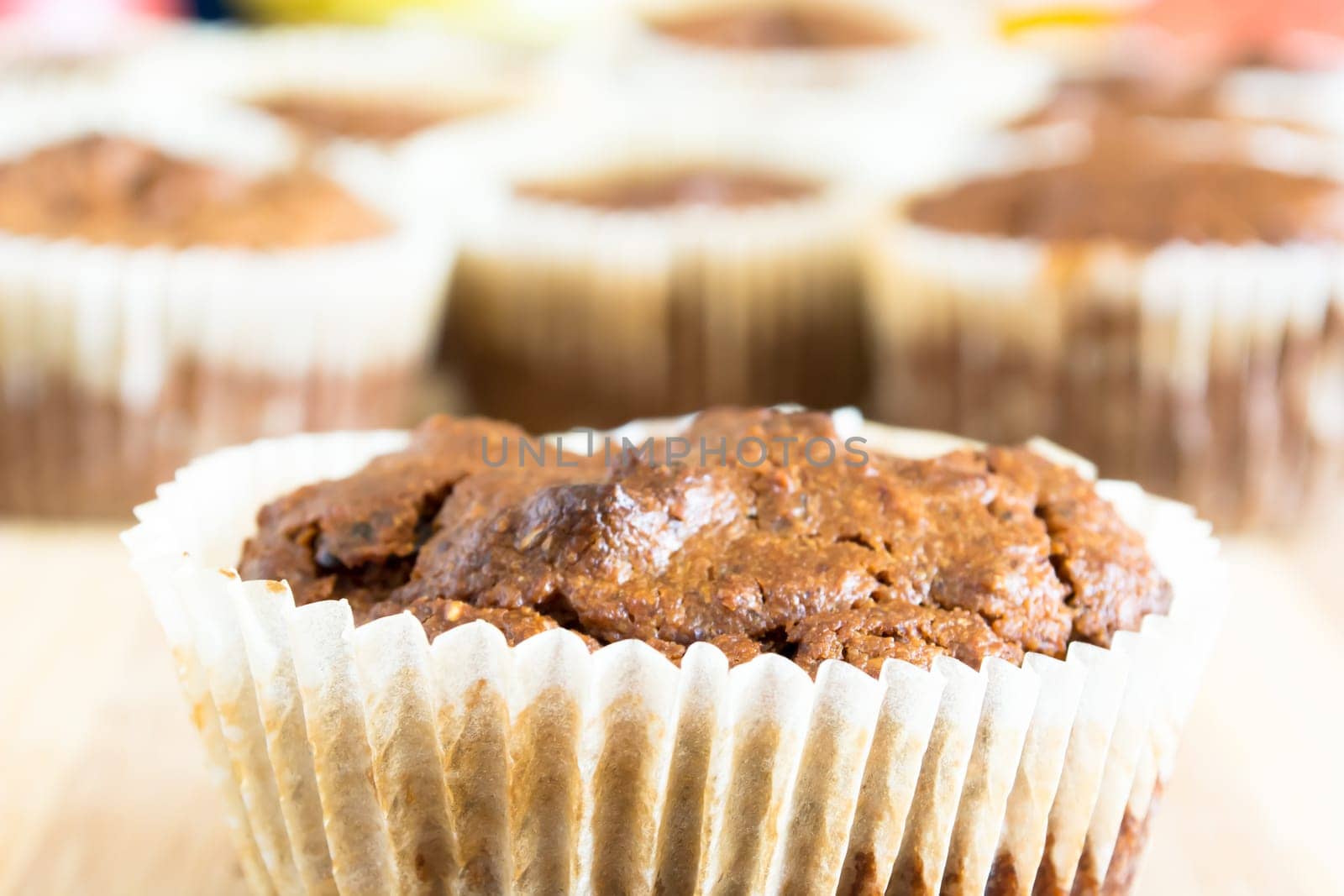 Just baked sweet chocolate cupcakes still in bake tray.