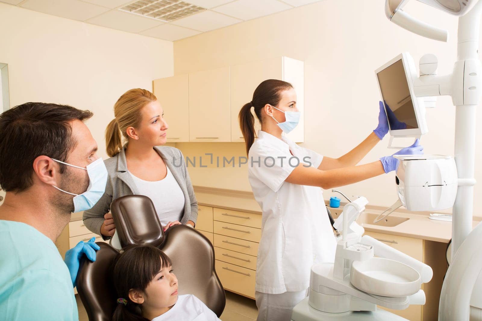 Little girl with her mother at the Dentist before treatment..