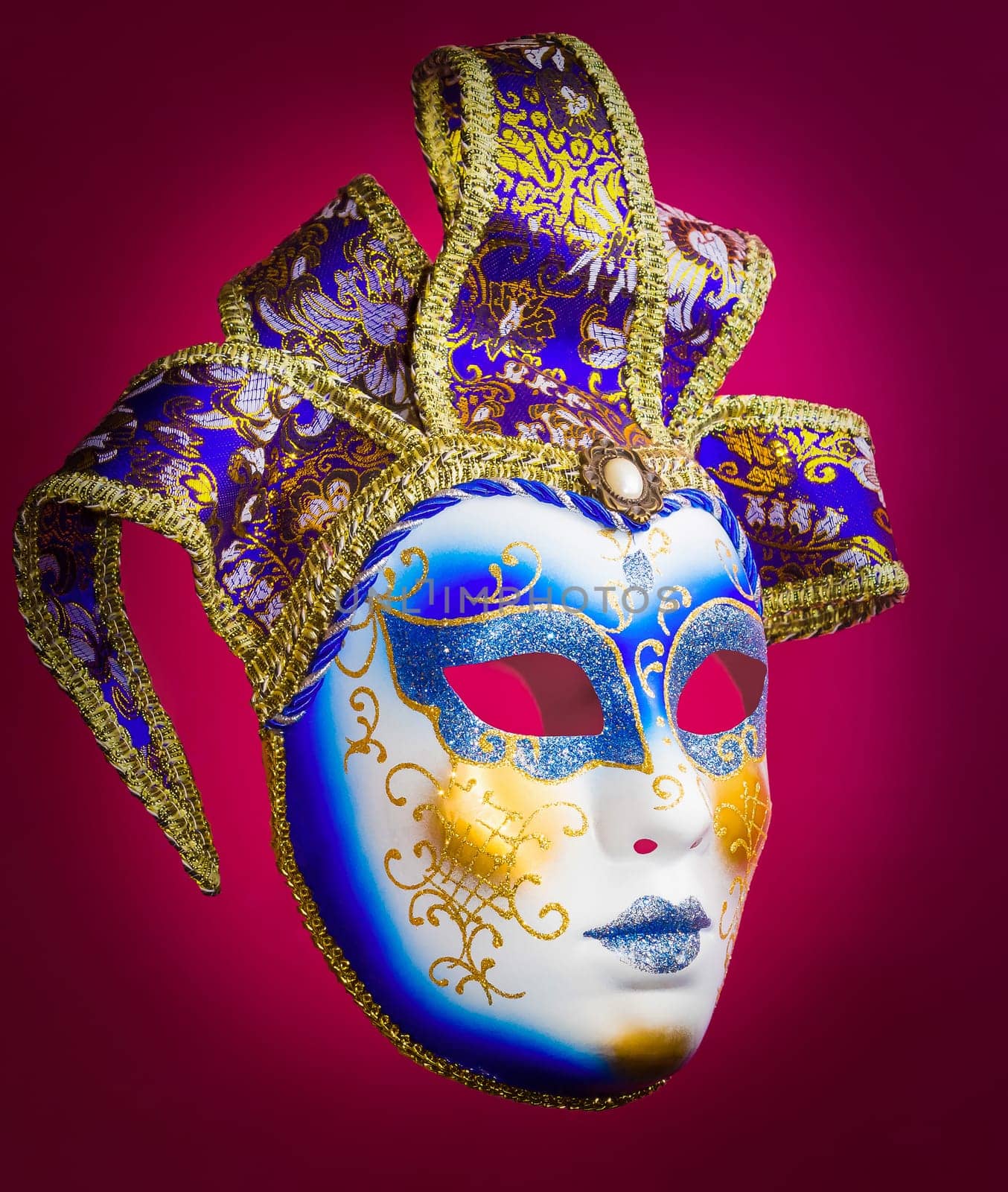 The traditional Venice mask on the red background