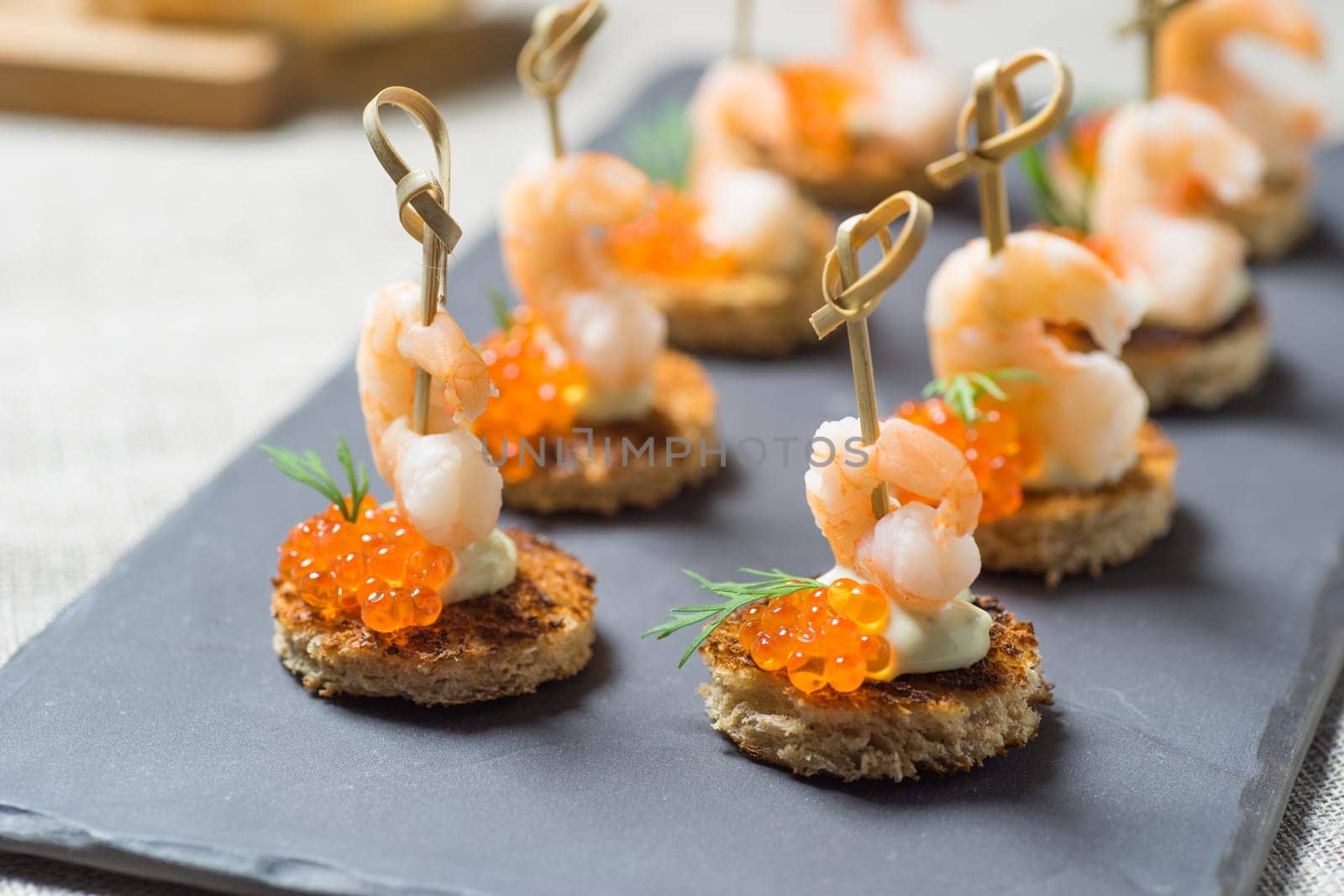 Shrimp Appetizer served on toasted bread with golden Caviar