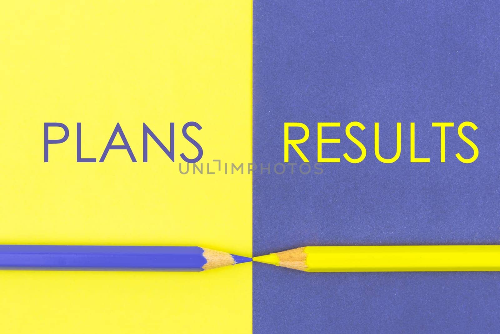 Plans versus Results contrast concept . Yellow and Violet coloured pencils and paper.