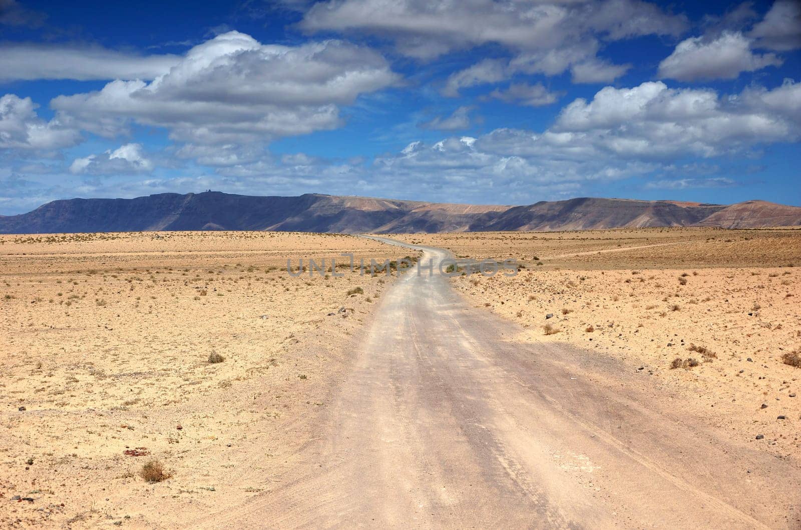 Piste through the desert steppe El Jable,Lanzarote