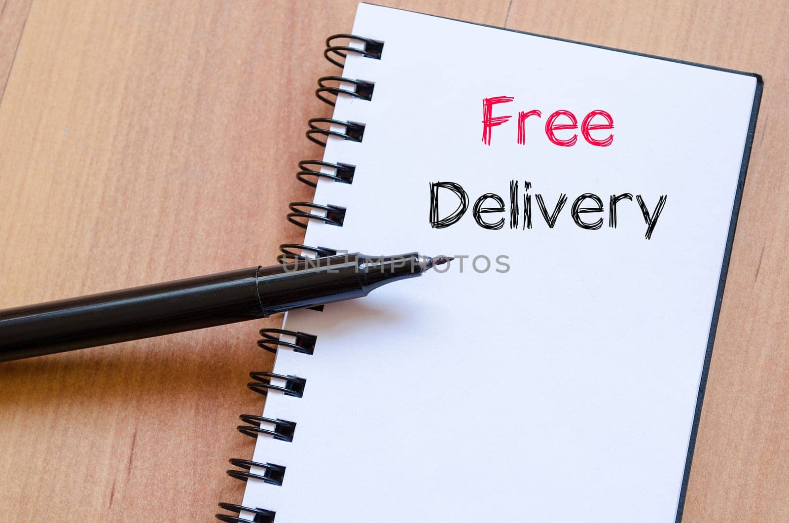 Free delivery text concept write on notebook