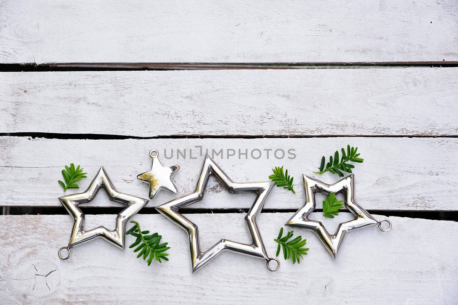 Christmas stars natural decoration on white wood background