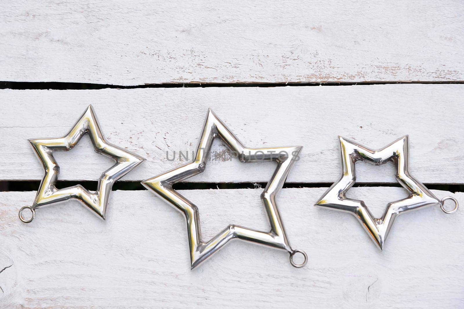 Christmas stars natural decoration on white wood background