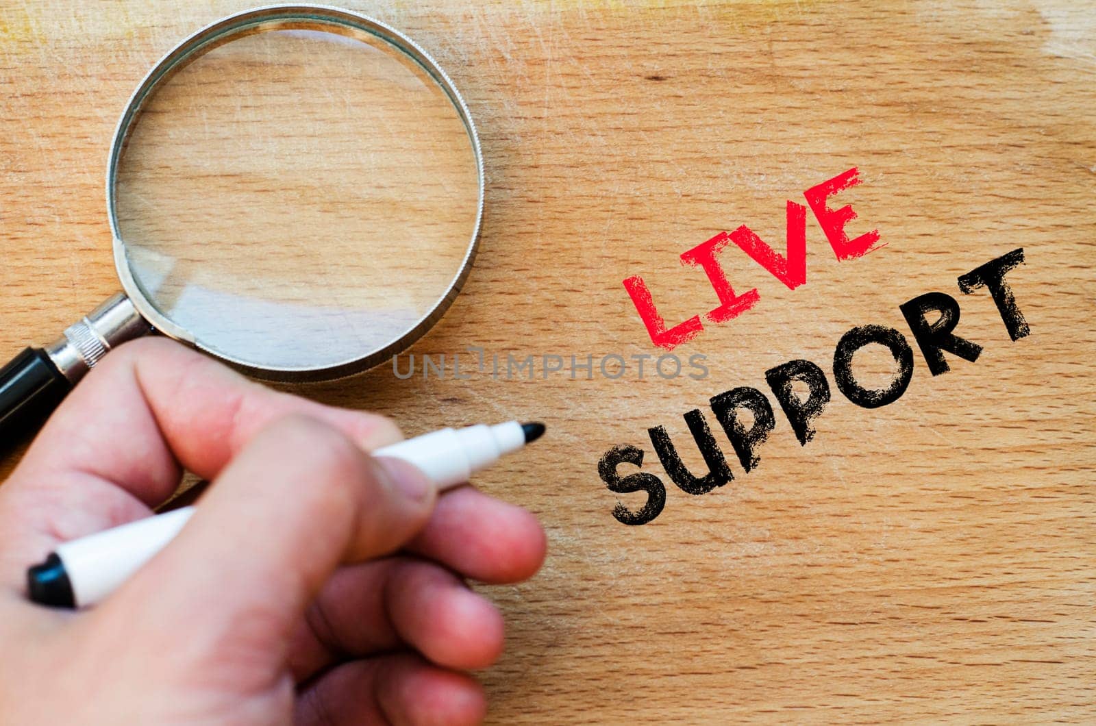 Live support text concept with human hand over wooden background