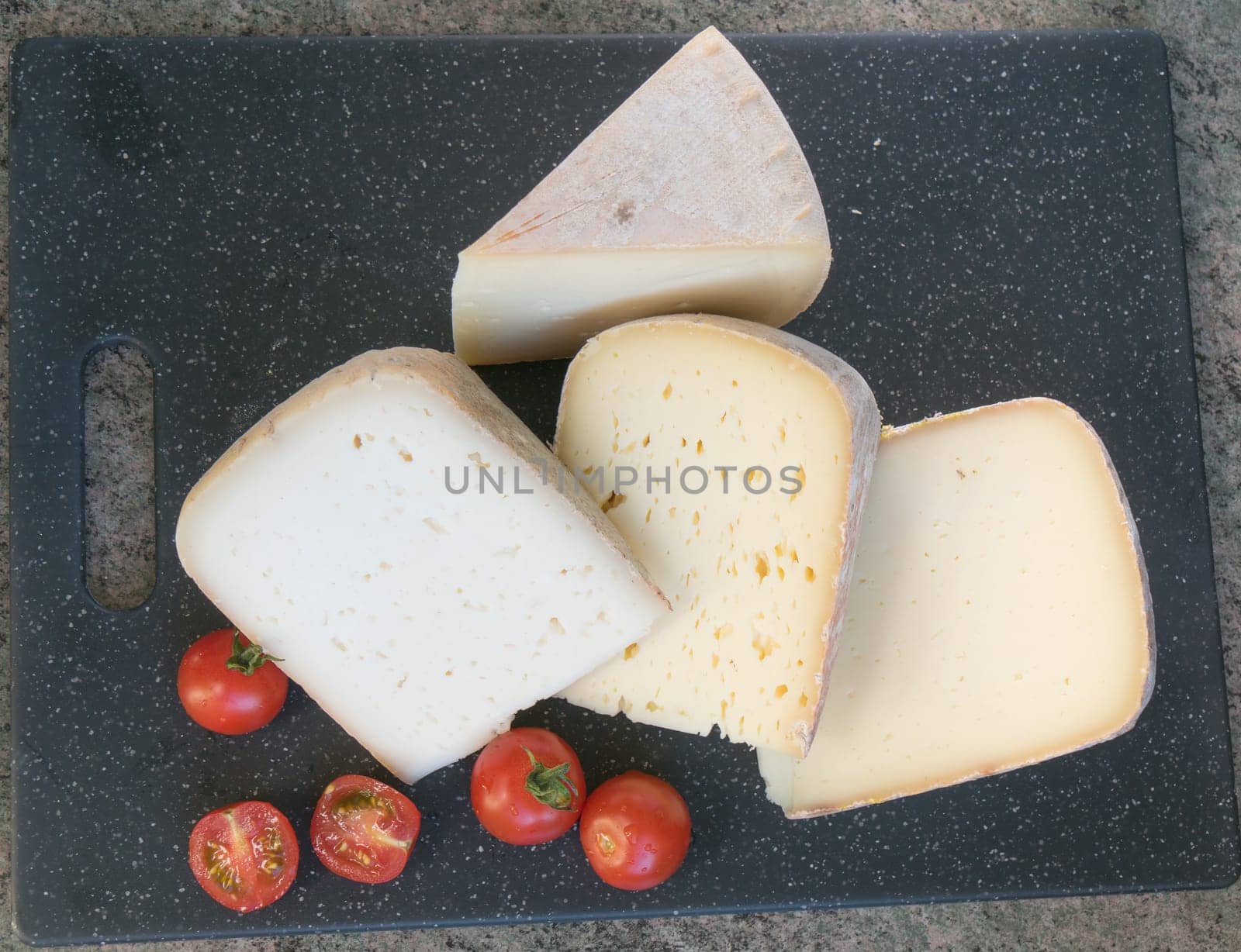 the different french cheese with cherry tomatoes