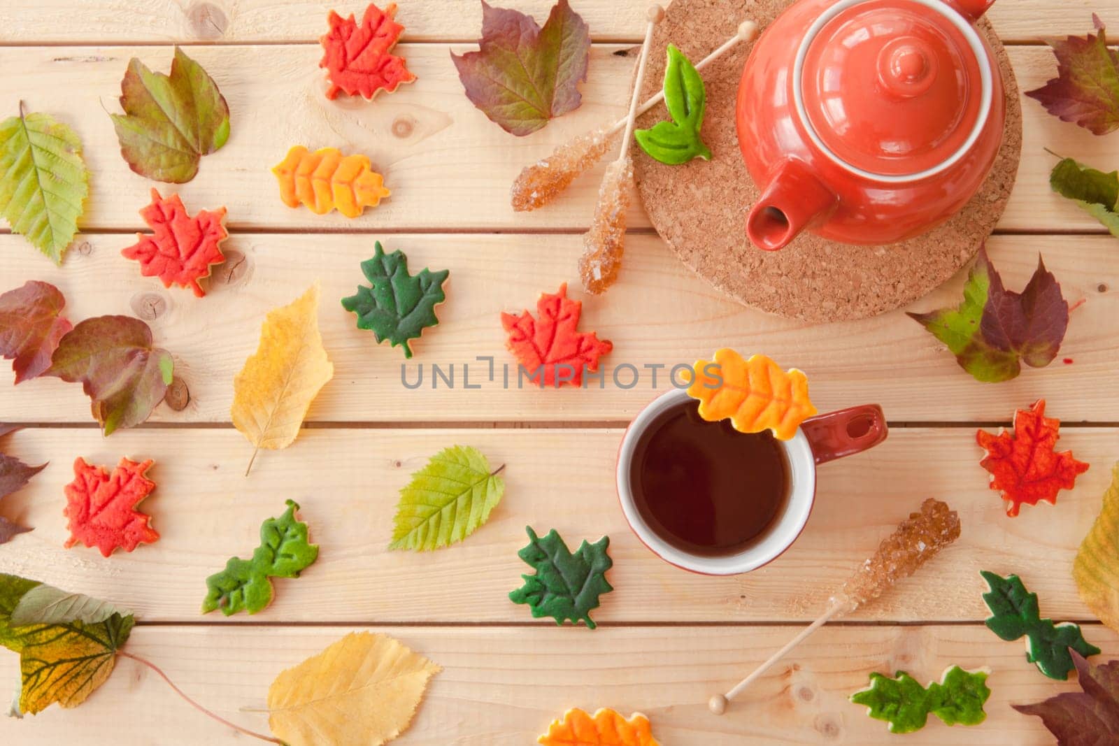 Hot tea and colorful cookies in autumn