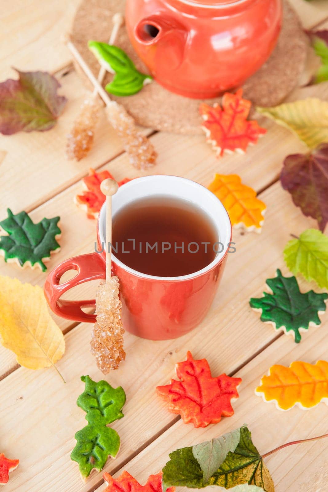 Hot tea and colorful cookies in autumn