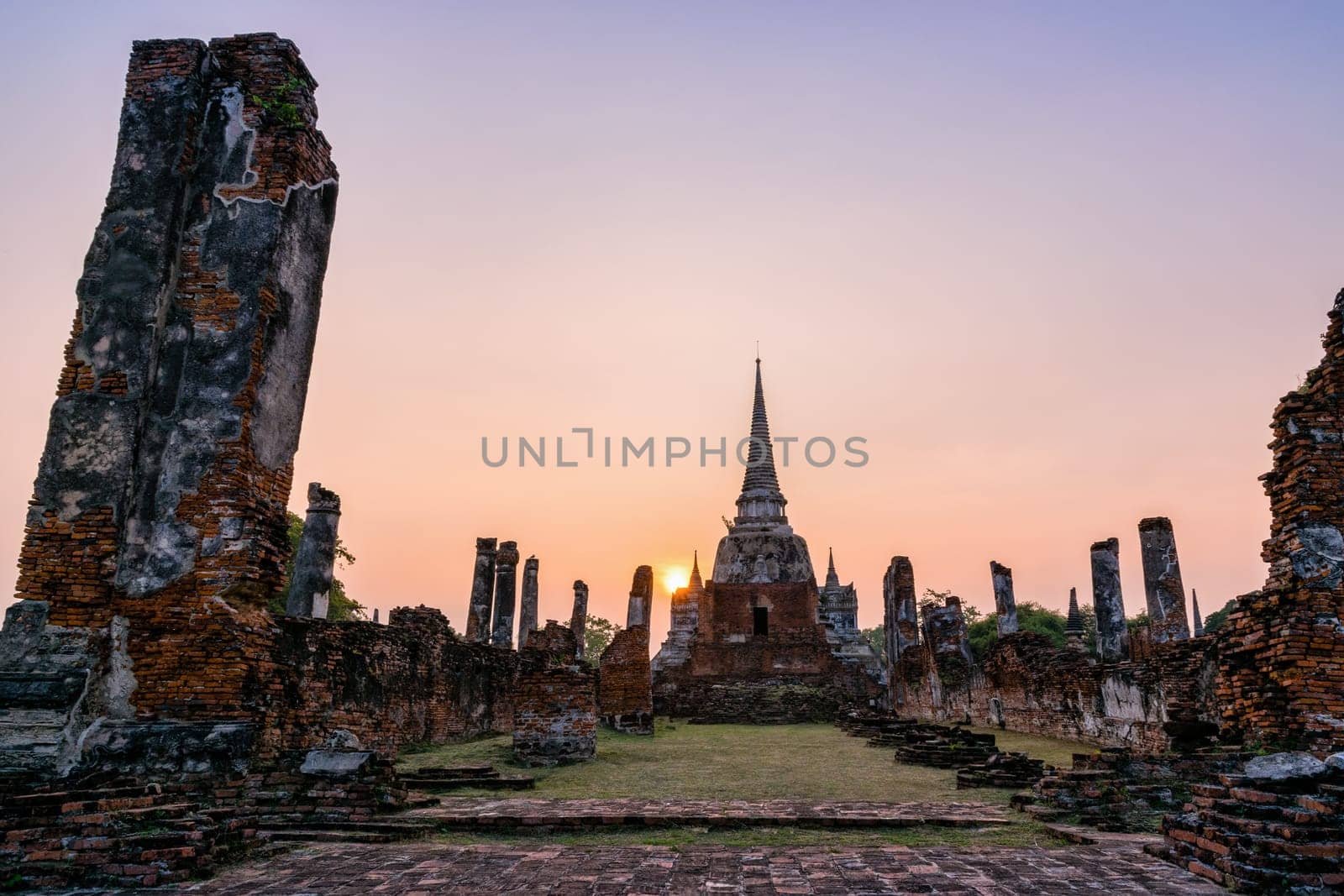 Ruins and pagoda ancient architecture of Wat Phra Si Sanphet old temple famous attractions during sunset at Phra Nakhon Si Ayutthaya Historical Park in Ayutthaya Province, Thailand