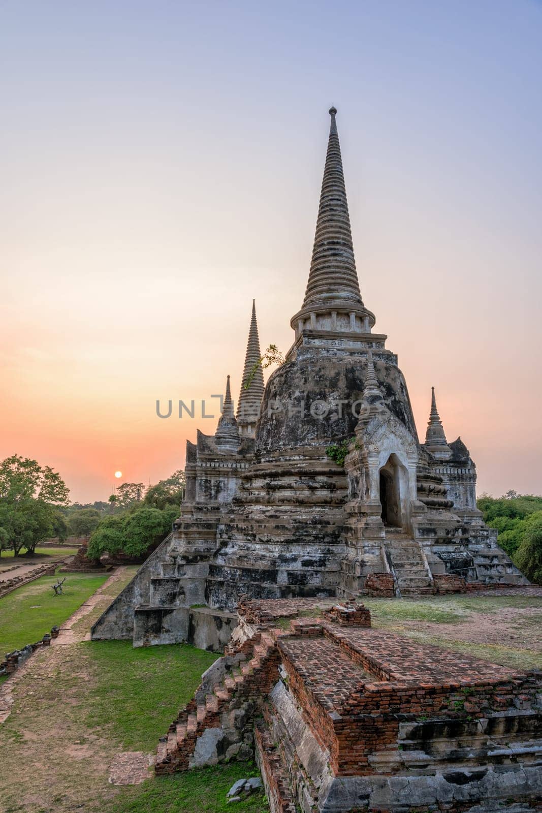 Ruins and pagoda ancient architecture of Wat Phra Si Sanphet old temple famous attractions during sunset at Phra Nakhon Si Ayutthaya Historical Park in Ayutthaya Province, Thailand