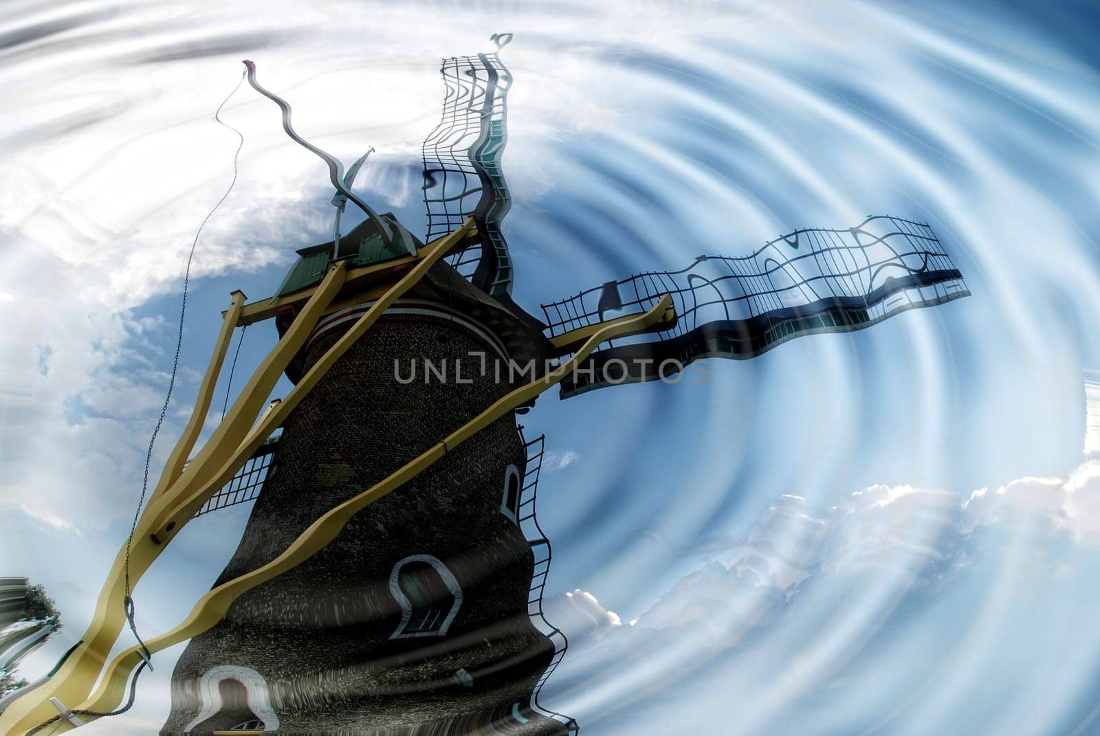 Windmill is reflected in the water with wavy water rings