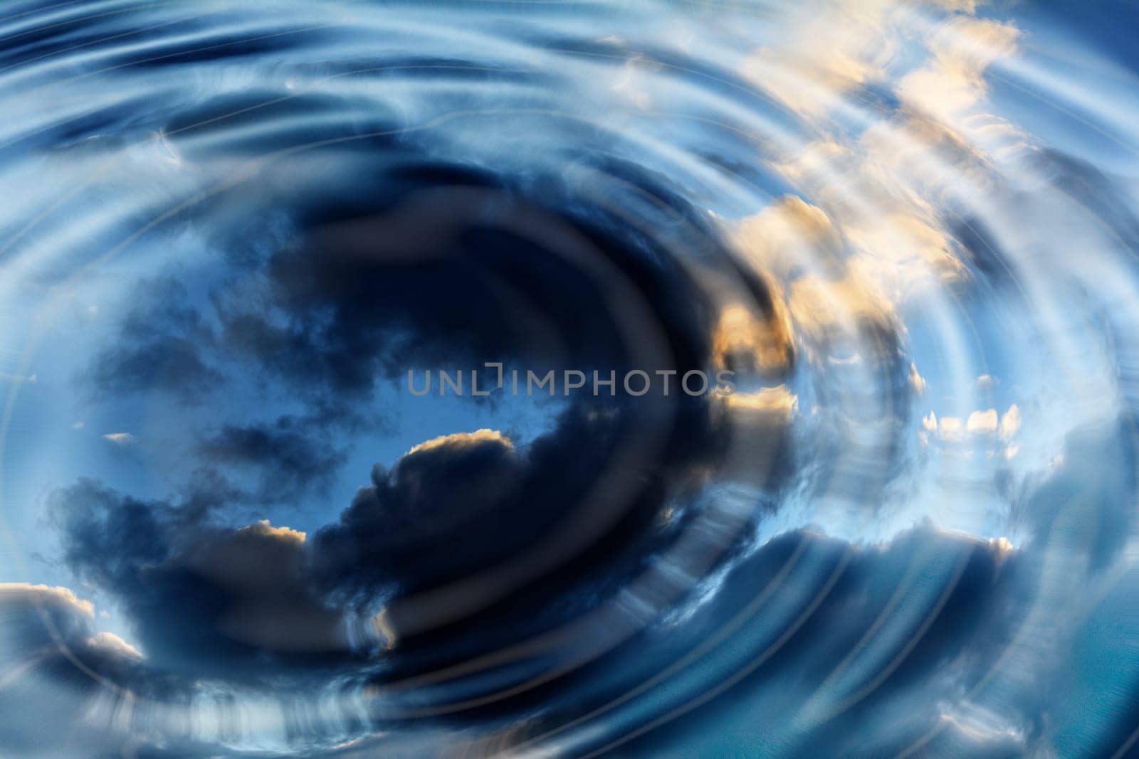 Reflection on water surface from the blue cloud sky