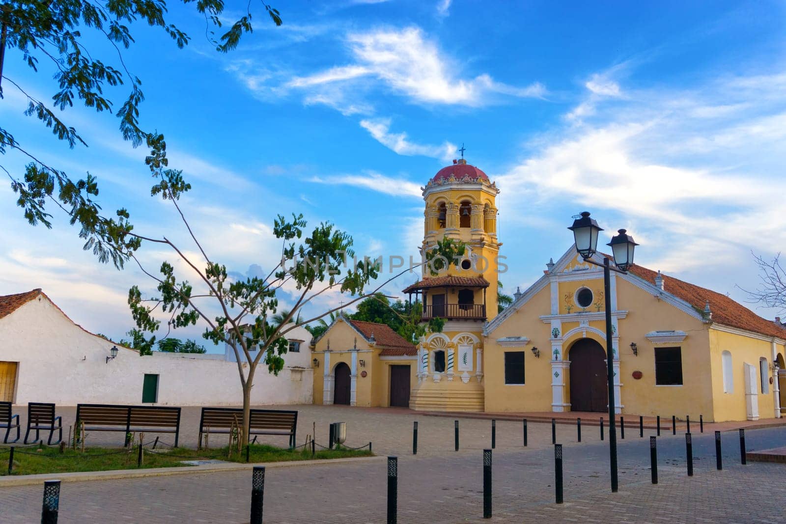 View of the yellow Santa Barbara church in Mompox, Colombia