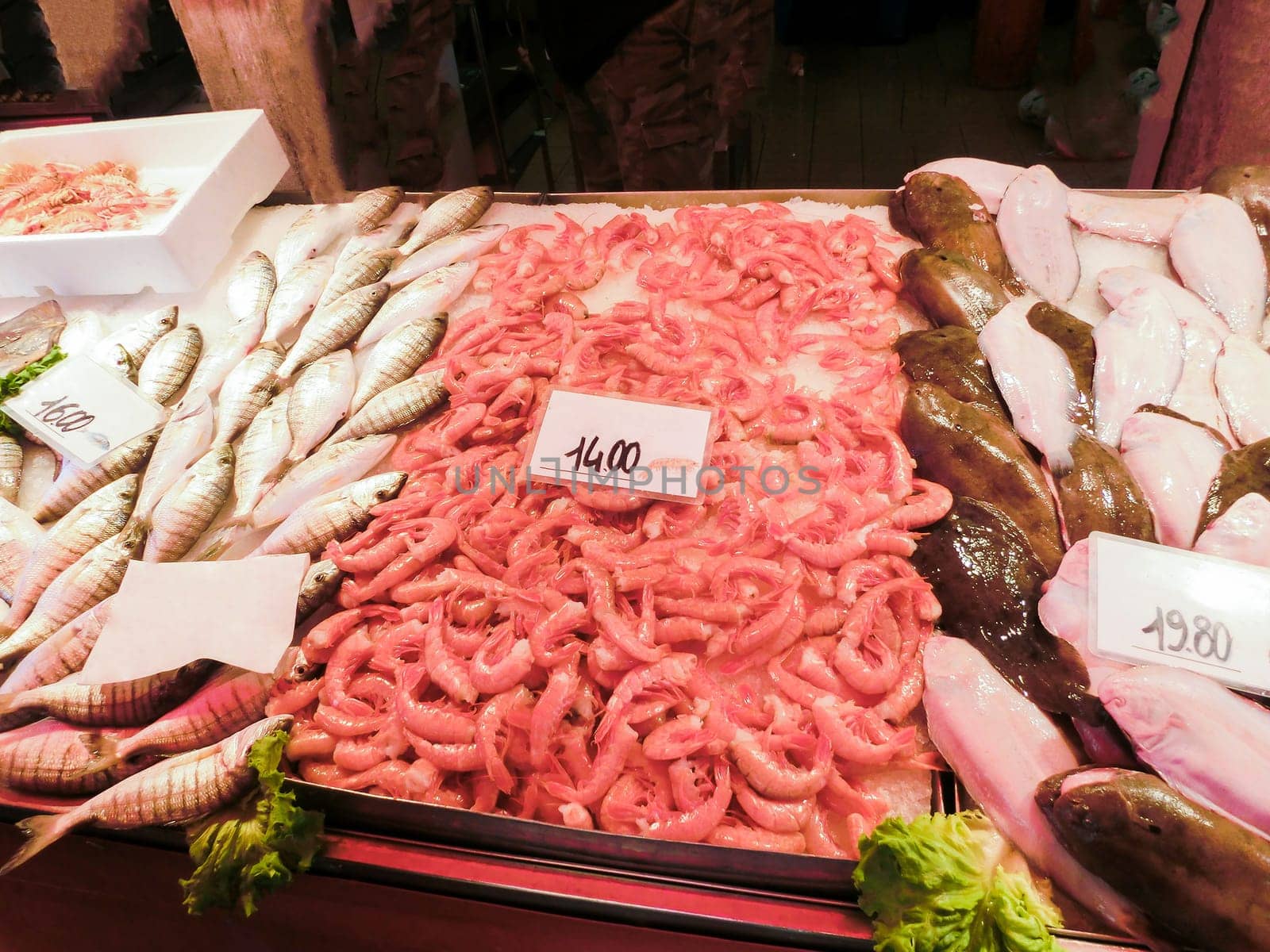 Venetian fish market - fish and prawns. The Rialto fish market is located alongside the Grand Canal near the Rialto Bridge - Venice, Italy