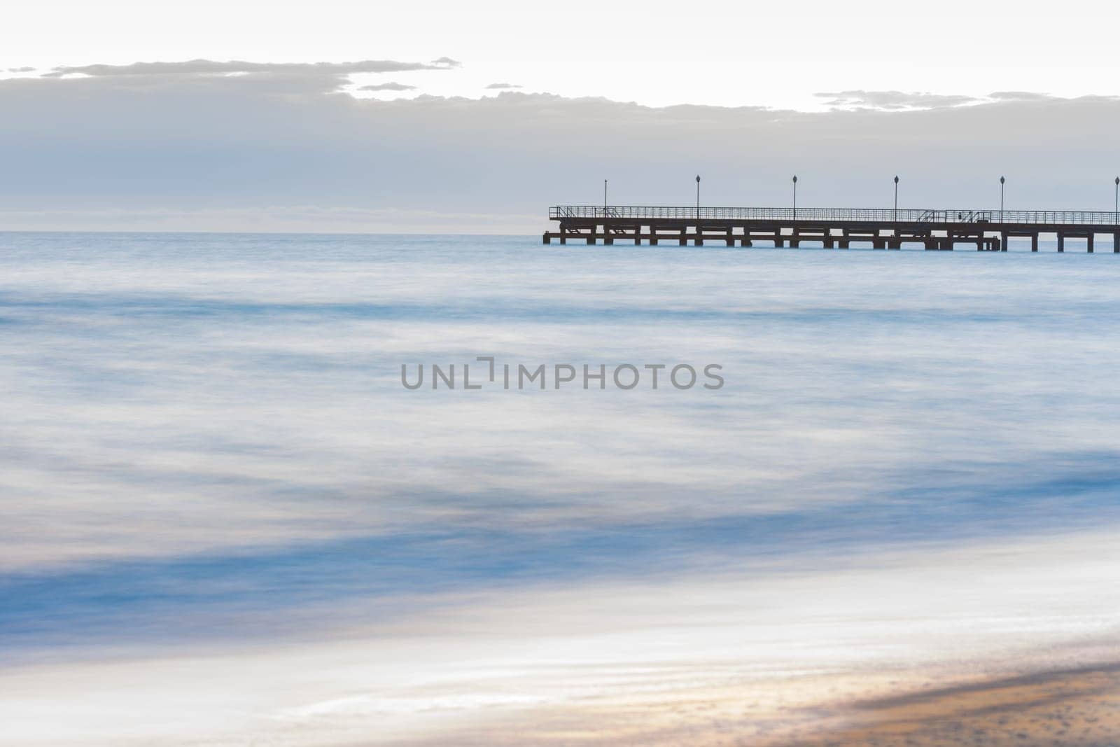 The seashore overlooking the marina after sunset, photographed with a long exposure