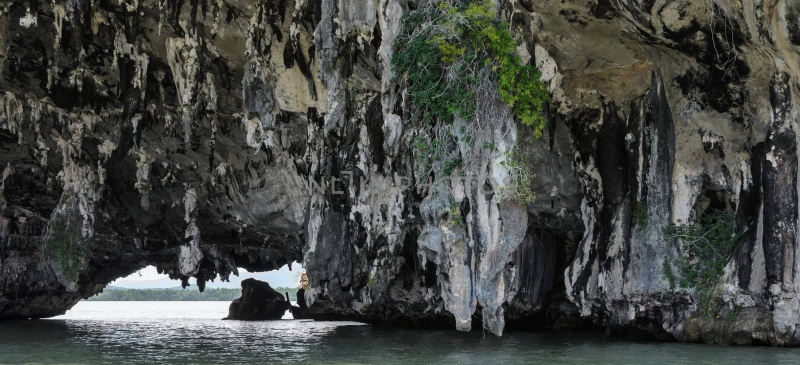 Sea cave of limestone island in Phang Nga Bay National Park, Thailand. The popular tourist destination for canoeing or kayaking