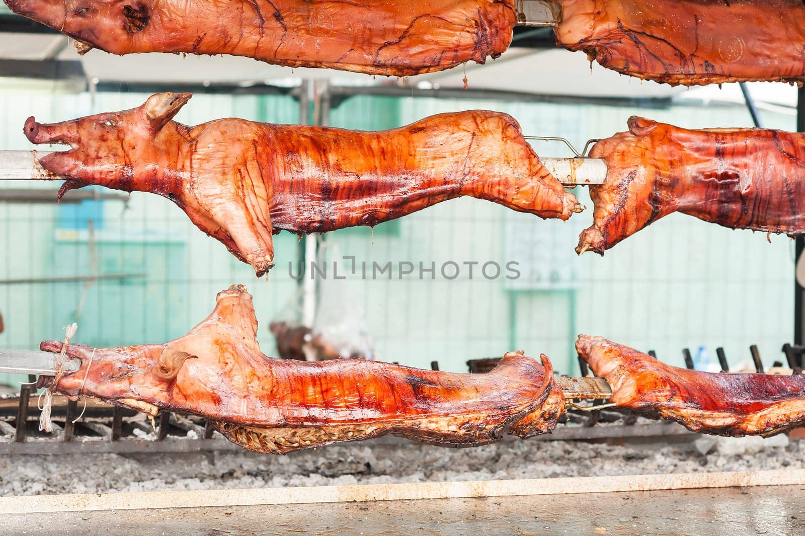 Baked roasted pork carcasses on the barbecue.