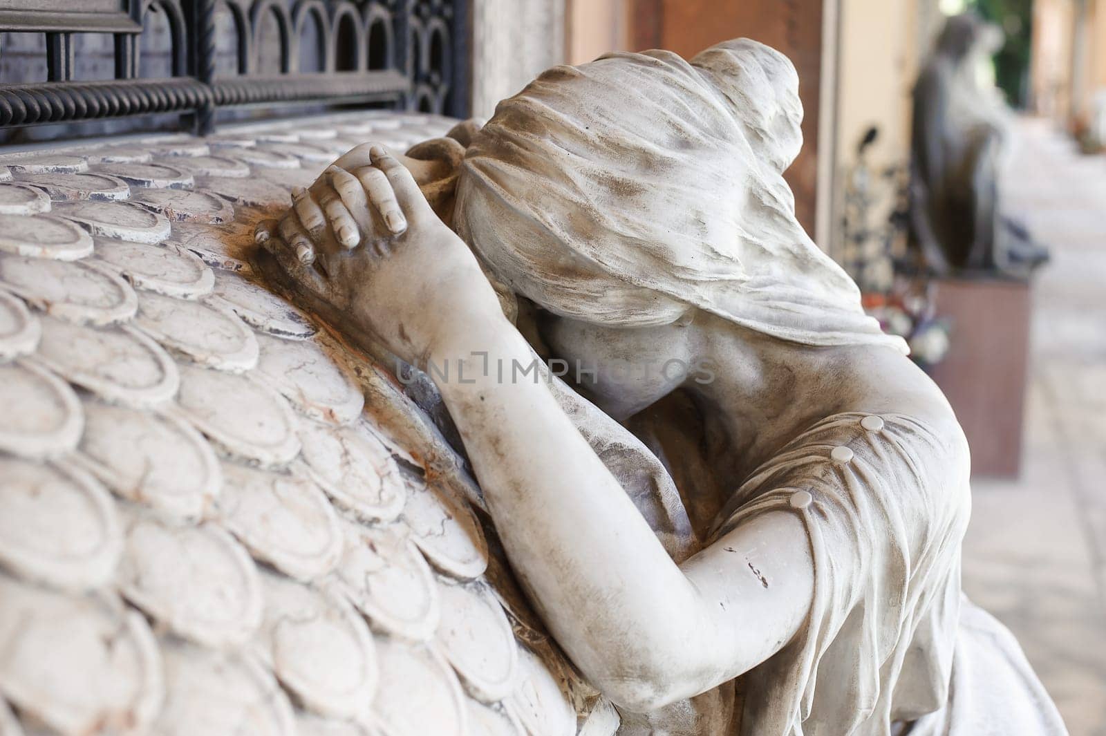 More than 100 years old statue. Cemetery located in North Italy.